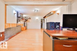 Wood-finish flooring with a drop ceiling and integrated lighting - 