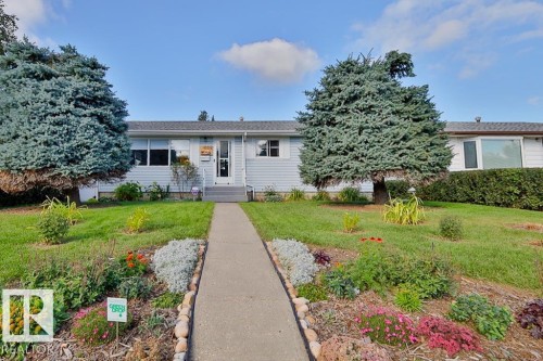 Light blue siding exterior with a dark shingle roof - 13312 123A Street Nw, Edmonton, AB 