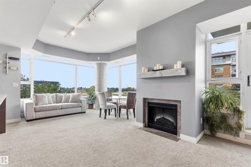#406 2504 109 St Nw, Edmonton, AB - Indoor Photo Showing Living Room With Fireplace