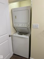 Stackable laundry appliances within a dedicated alcove - 