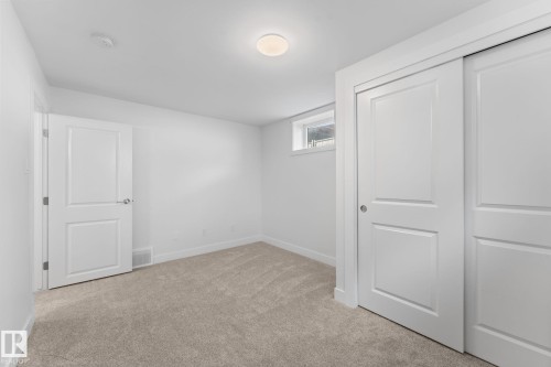 Plush carpeting, and a window for natural illumination - 6108 102 Avenue Nw, Edmonton, AB 