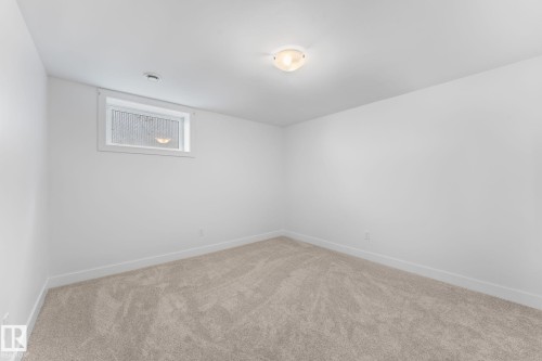 Plush carpeting, and a window for natural illumination - 6108 102 Avenue Nw, Edmonton, AB 