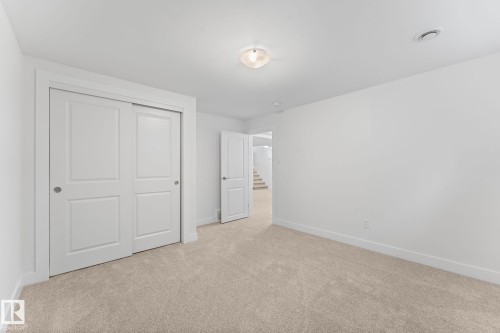 Plush carpeting, and a window for natural illumination - 6108 102 Avenue Nw, Edmonton, AB 