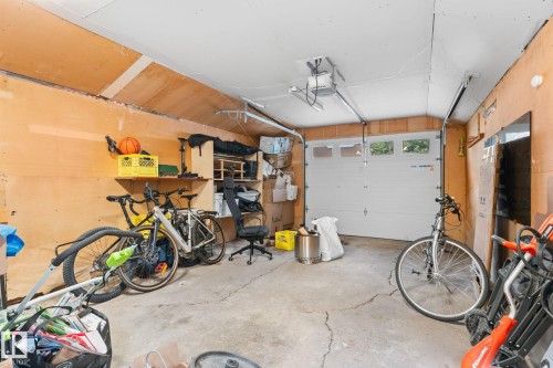 Concrete flooring, overhead lighting, and built-in shelving - 6108 102 Avenue Nw, Edmonton, AB 
