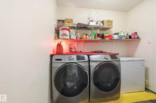 Utility area with wall-mounted shelving - 941 Ebbers Crescent Nw, Edmonton, AB 
