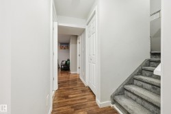 Wood-finish flooring throughout the hallway - 
