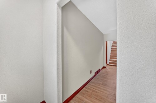 Hallway featuring wood-finish flooring and baseboards - 9719 71 Avenue Nw, Edmonton, AB - Indoor Photo Showing Other Room