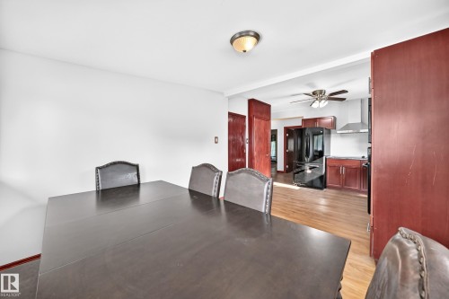 Open concept living area with light wood-finish flooring - 9719 71 Avenue Nw, Edmonton, AB - Indoor