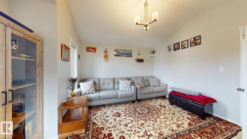 Vaulted ceiling and a brass-finish chandelier - 22407 99 Avenue Nw, Edmonton, AB 