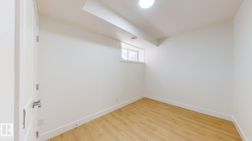 Recessed lighting, wood-finish flooring, white trim, and a window for natural light - 22407 99 Avenue Nw, Edmonton, AB 