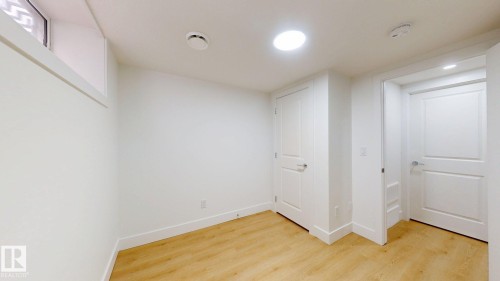 Recessed lighting, wood-finish flooring, and white paneled doors - 22407 99 Avenue Nw, Edmonton, AB 