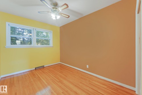 Hardwood flooring, white trim, dual-pane window, and ceiling fan with integrated lighting - 11507 135 Street Nw, Edmonton, AB 