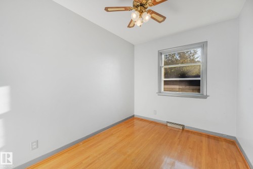 Hardwood flooring, painted walls, window with trim, ceiling fan light fixture - 11507 135 Street Nw, Edmonton, AB 