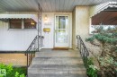 Concrete front steps with wrought iron railings - 11507 135 Street Nw, Edmonton, AB 