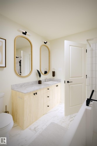 Dual vanity with a light wood-finish cabinet and grey-veined countertop - 56 Cessy Street, St. Albert, AB - Indoor