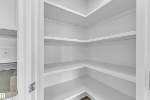 White corner shelving with multiple levels - 2912 31 Street Nw, Edmonton, AB 