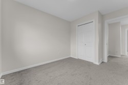 Light gray wall paint, gray carpeting, and white trim - 