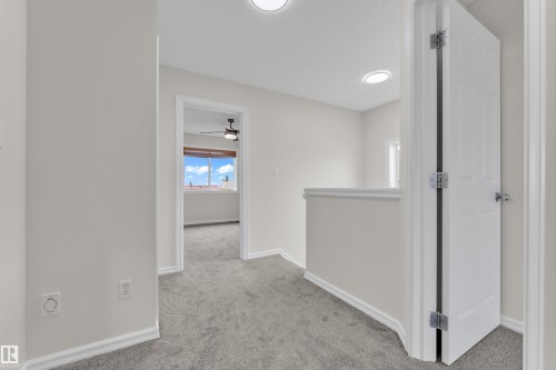 Carpeted flooring, recessed lighting, interior doors, and a ceiling fan - 2912 31 Street Nw, Edmonton, AB 
