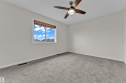 Wall-to-wall carpeting and a ceiling fan with integrated lighting - 