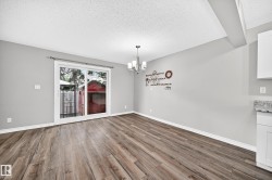 Wood-finish flooring with neutral wall tones and white trim - 