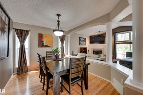 1524 Breckenridge Close Nw, Edmonton, AB - Indoor Photo Showing Dining Room With Fireplace