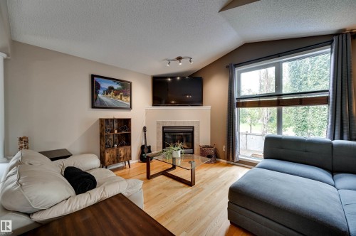 1524 Breckenridge Close Nw, Edmonton, AB - Indoor Photo Showing Living Room With Fireplace