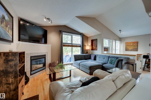 1524 Breckenridge Close Nw, Edmonton, AB - Indoor Photo Showing Living Room With Fireplace