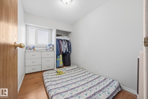 Wood-finish flooring, built-in window and storage unit, and open closet space - #2 14120 80 St Nw, Edmonton, AB 