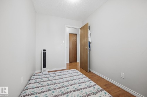 Wood-finish flooring with light-toned walls and ceiling - #2 14120 80 St Nw, Edmonton, AB 