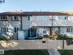 Stucco and siding exterior with a shingle roof - 