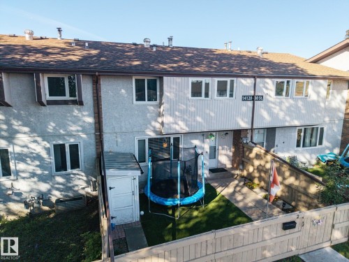 Multi-level exterior with a shingled roof and multiple windows - #2 14120 80 St Nw, Edmonton, AB 