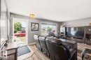 Wood-finish flooring, light grey wall paint, and a white ceiling with a flush-mount light fixture - 13427 83 Street Nw, Edmonton, AB 