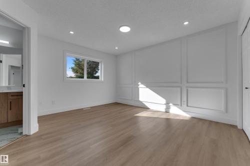 Wood-finish flooring, recessed lighting, and a window with exterior views - 3320 43 Street Nw, Edmonton, AB 