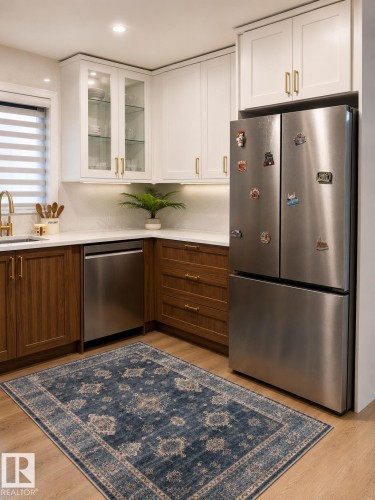 Wood-finish flooring with white and wood-finish cabinetry - 3830 22 Street Nw, Edmonton, AB 