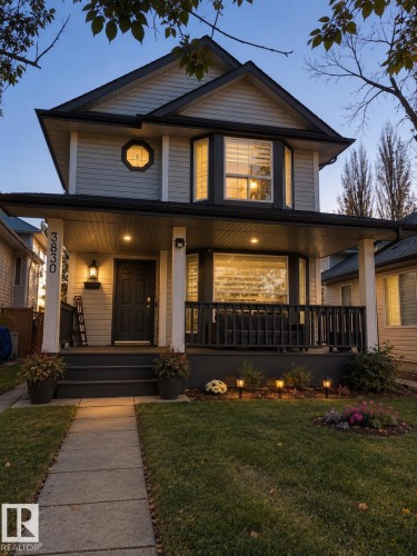 Two-story residence with a covered front porch and a bay window - 3830 22 Street Nw, Edmonton, AB 