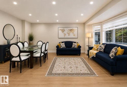 Recessed lighting, bay window, wood-finish flooring, and neutral wall tones - 3830 22 Street Nw, Edmonton, AB 