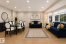 Recessed lighting, bay window, wood-finish flooring, and neutral wall tones - 3830 22 Street Nw, Edmonton, AB 