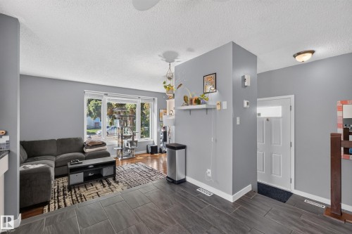 Hardwood flooring, large windows, and contemporary wall color - 333 Kirkpatrick Crescent Nw, Edmonton, AB 