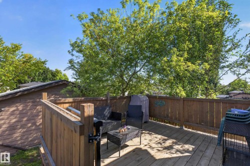 Outdoor wood-plank deck with a wood privacy fence - 333 Kirkpatrick Crescent Nw, Edmonton, AB 
