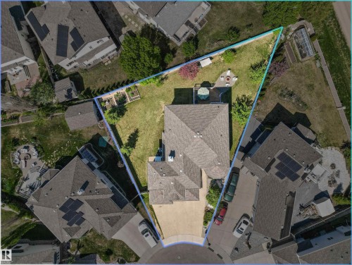Expansive property featuring a large, irregularly shaped lot with a substantial green space - 703 107A Street Sw, Edmonton, AB 