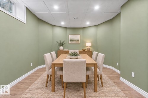 Recessed lighting, wood-finish flooring, white trim, and a window - 703 107A Street Sw, Edmonton, AB 