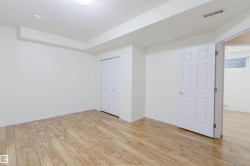 Wood-finish flooring, bi-fold closet doors, and recessed ceiling lighting - 