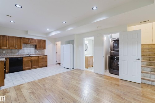 Wood-finish flooring and recessed lighting throughout - 11608 96 Street Nw, Edmonton, AB 