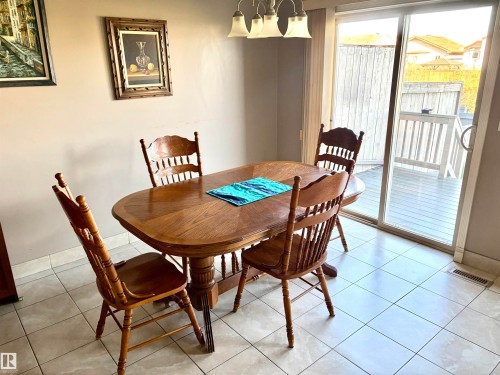Sliding glass door, outdoor decking, and ceramic tile flooring - #17 16317 64 St Nw, Edmonton, AB 