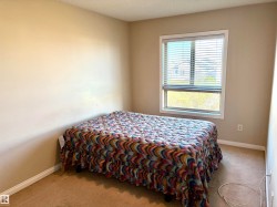 Neutral-toned walls complement the carpeted flooring - 