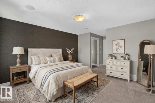 Textured accent wall, light grey painted walls, white trim, recessed ceiling speakers, and a flush mount ceiling light - 1850 Rutherford Road Sw, Edmonton, AB 