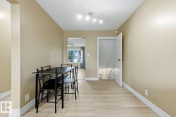 Light-toned tile flooring, neutral wall paint, and recessed ceiling lighting - 