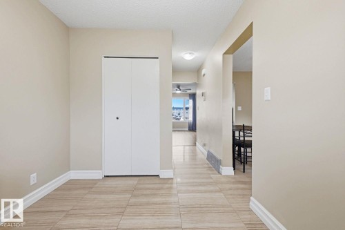 Tiled flooring throughout, neutral wall tones, and white trim - 11317 22 Avenue Nw, Edmonton, AB 