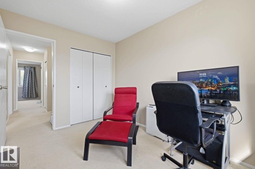 Neutral-toned walls complement the light-colored carpeting - 11317 22 Avenue Nw, Edmonton, AB 