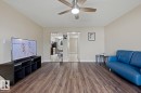 Recessed lighting, wood-finish flooring, and a ceiling fan with integrated lighting - 11317 22 Avenue Nw, Edmonton, AB 